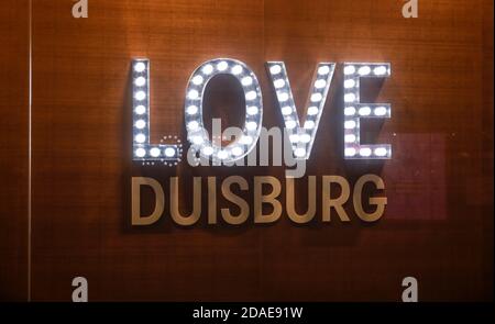 Duisburg, North Rhine-Westphalia, Germany - Love Duisburg, illuminated lettering in the shop window of a retail store. Stock Photo