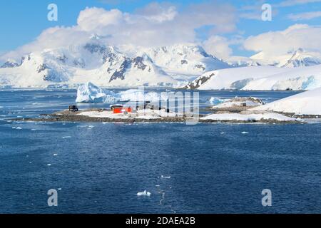 Frozen coasts, icebergs, mountain and the Chilean González Videla Antarctic Base in  Paradise Bay on the Danco Coast, Antarctica Stock Photo