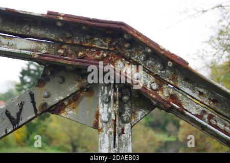 Rusty rivet joint on the old bridge. A forgotten steel structure. Stock Photo