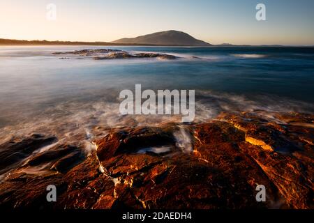 Sunset on Dunbogan Beach in Crowdy Bay National Park. Stock Photo