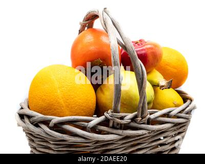 Basket with fruits isolated on white background Stock Photo