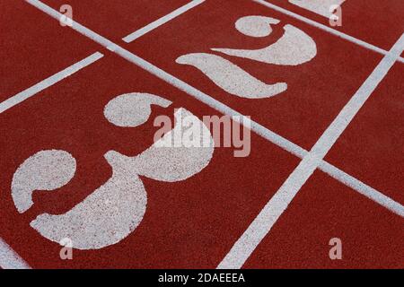 Numbered stadium running tracks. Numbers and lines on jogging runway Stock Photo