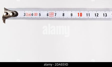 Measuring roulette on a white background banner with copy space for text. A construction tool Stock Photo