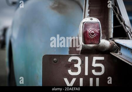 Close up of a tail light on an old American truck at an enthusiast's rally in England, UK Stock Photo