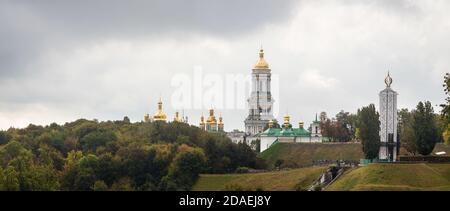 KYIV, UKRAINE - Sep. 29, 2019: Kiev Pechersk Lavra. Cathedral of the Dormition and Monument to the victims of the Holodomor Stock Photo