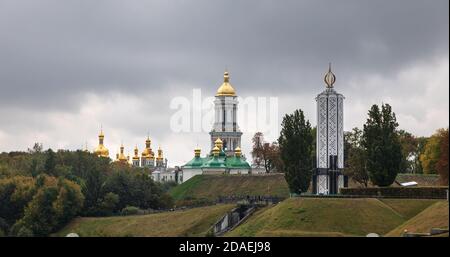 KYIV, UKRAINE - Sep. 29, 2019: Kiev Pechersk Lavra. Cathedral of the Dormition and Monument to the victims of the Holodomor Stock Photo