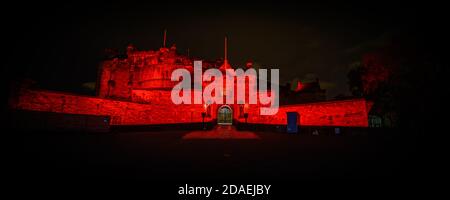 Wed 11 November 2020. Edinburgh, UK. Edinburgh Castle lit up in red light as part of the #LightUpRed2020 campaign organised by Poppy Scotland to commemorate Remembrance Day 2020. COVID-19 had a massive impact on the organisation’s ability to run street collections this year and the Lit Up Red campaign helped them raise awareness for the Scottish Poppy Appeal. Stock Photo