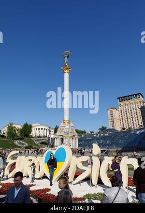 KIEV, UKRAINE - May 01, 2017: Emblem of Eurovision against Independence Monument on Maidan Nezalezhnosti (Independence Square) in Kiev Stock Photo
