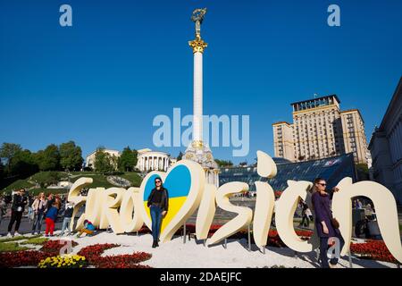 KIEV, UKRAINE - May 01, 2017: Emblem of Eurovision against Independence Monument on Maidan Nezalezhnosti (Independence Square) in Kiev Stock Photo