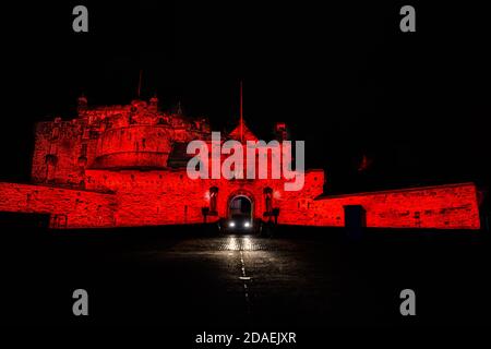 Wed 11 November 2020. Edinburgh, UK. Edinburgh Castle lit up in red light as part of the #LightUpRed2020 campaign organised by Poppy Scotland to commemorate Remembrance Day 2020. COVID-19 had a massive impact on the organisation’s ability to run street collections this year and the Lit Up Red campaign helped them raise awareness for the Scottish Poppy Appeal. Stock Photo