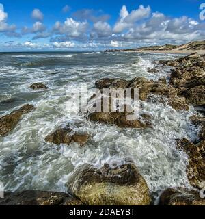 View of Ambleteuse in france over the waves breaking on the rocks Stock Photo