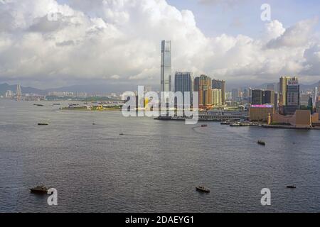 HONG KONG -29 JUN 2019- Day view of the Victoria Harbor in Hong Kong under dark cloudy skies. Stock Photo