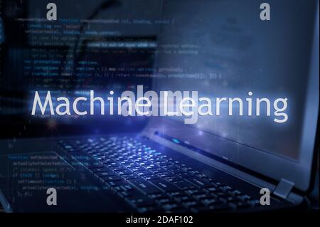 Machine learning inscription against laptop and code background. Learn machine learning programming language, computer courses, training. Stock Photo
