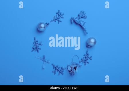 Christmas composition. Frame made of silver decoration. Christmas, winter, new year concept. Toned classic blue trend color - Image Stock Photo