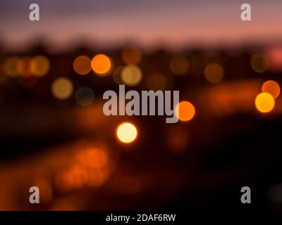 Bokeh in the night city - defocused street lamps and lights from windows Stock Photo