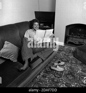 Aston, Birmingham born Paul Henry ATV Crossroads actor relaxes iin  his Birmingham home as he reads a Crossroads script for the following week Stock Photo