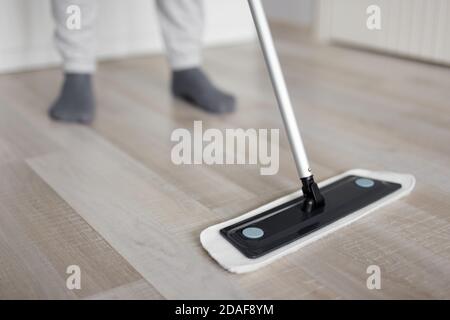 close up of man washing floor with mop at home Stock Photo