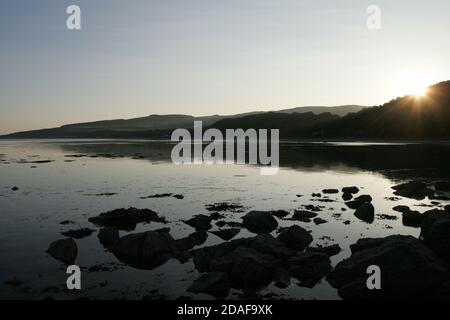 Croy Shore, Ayrshire, Scotland, Early morning light illuminates the beach at Croy as seen from Culzean Castle Stock Photo