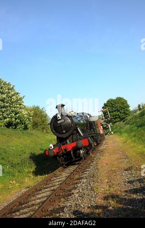 '3850' leaving Winchcombe with a goods train and heading towards Greet Tunnel. Stock Photo