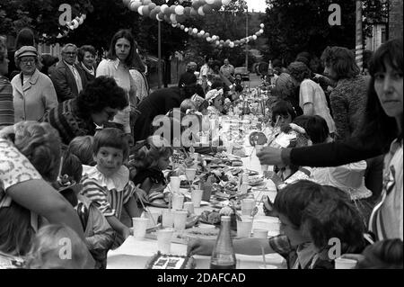 File photo dated 01/06/77 of residents of Woodford Bridge, Essex, celebrating Queen Elizabeth II's Silver Jubilee with a street party for local children. Stock Photo