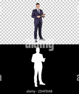 Expressive young businessman with tablet presenting something sw Stock Photo