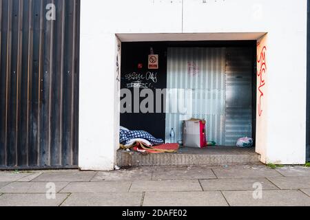 The belongings of someone sleeping rough left on the street. Stock Photo