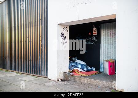 The belongings of someone sleeping rough left on the street. Stock Photo