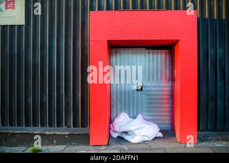 The belongings of someone sleeping rough left on the street. Stock Photo