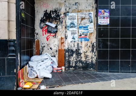 The belongings of someone sleeping rough left on the street. Stock Photo