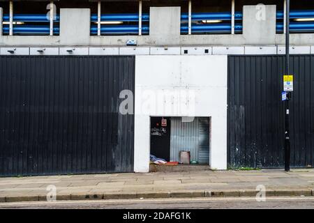 The belongings of someone sleeping rough left on the street. Stock Photo