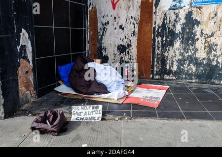 The belongings of someone sleeping rough left on the street. Stock Photo