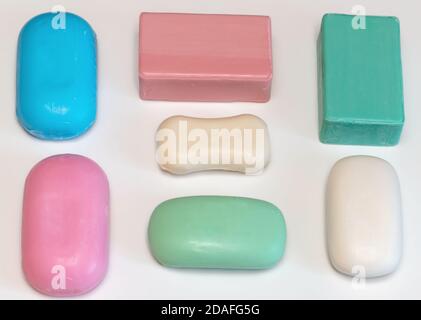 Lump hand soap. Hygiene and prevention of viral diseases concept. Variety of colorful natural soap bars, close-up, selective focus. Stock Photo