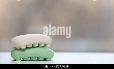 Lump hand soap. Hygiene and prevention of viral diseases concept.Variety of colorful natural soap bars, copy space. Stock Photo