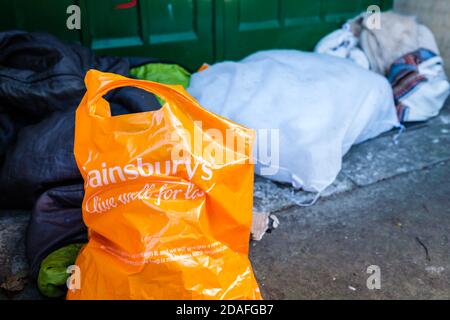 The belongings of someone sleeping rough left on the street. Stock Photo