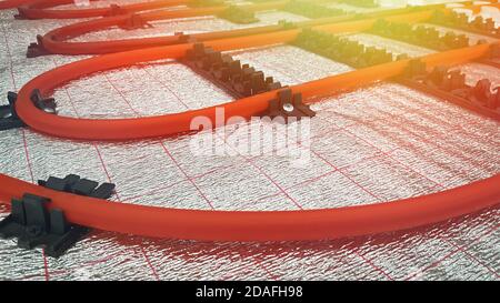 Underfloor heating pipe. Installation of engineering systems in a building. Lens glare Stock Photo