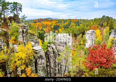 Prachov Rocks, Czech: Prachovske skaly, with colorful trees of autumn. Sandstone rock formation in Bohemian Paradise, Czech Republic. Stock Photo