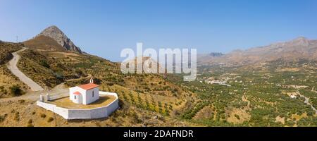 Aerial panoramic view of a small Greek Orthodox church near the village of Gianniou, Foinikas, Crete, Greece Stock Photo