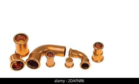 Close up view of different copper plumbing pipes isolated on white background. Stock Photo