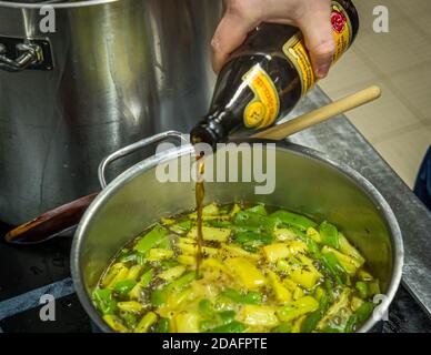 Melange of good ingredients: Savory and saffron as well as a good sip of Schlenkerla Rauchbier go into the soup pot in Bamberg, Germany Stock Photo