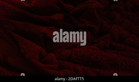 Dark burgundy waves from terry cloth.colorful fabric texture background. Stock Photo