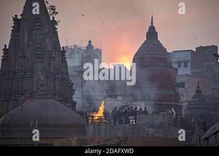 Varanasi, India, December 2015. Manikarnika, the main funerary ghat at dusk. Stock Photo