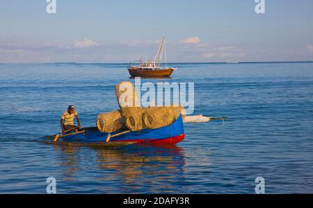 Canoe with fishing basket on the beach, Nosy Komba, Madagascar Stock Photo