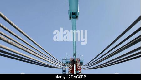 cables of port Industrial crane for lifting heavy containers Stock Photo