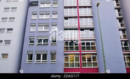 violet colorful building facade with windows. modern german european architecture style. Stock Photo