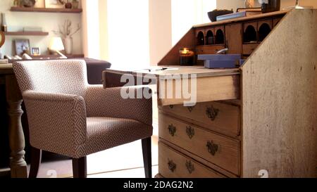 old vintage work small desk and chair, interior background. Stock Photo