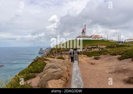 Cabo da Roca/ Portugal-June 1st, 2017: Cabo da Roca lighthouse above the Atlantic ocean, most western point of european land with only deep blue sea a Stock Photo