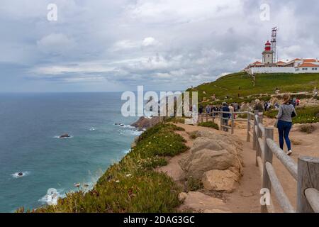 Cabo da Roca/ Portugal-June 1st, 2017: Cabo da Roca lighthouse above the Atlantic ocean, most western point of european land with only deep blue sea a Stock Photo