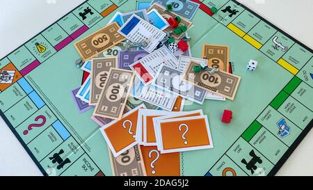 Orlando, FL/USA-12/20/19:  Pieces for the game Monopoly by Hasbro on a white background.  Concept business, banking, property, and game over. Stock Photo