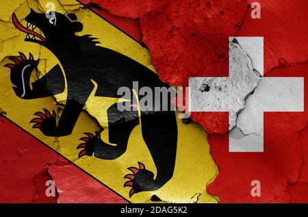 flags of Bern canton and Switzerland painted on cracked wall Stock Photo