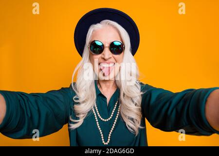 Closeup photo of cool crazy granny lady making selfies feel young